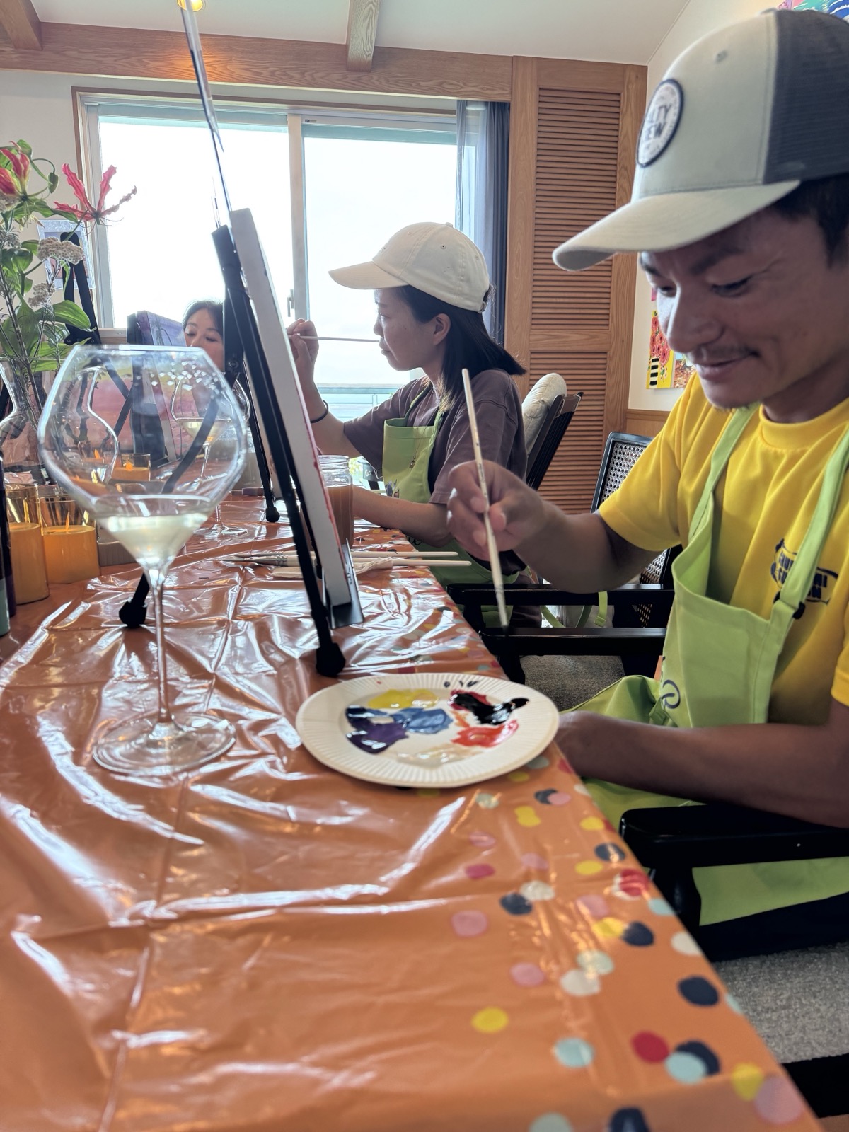 Pinto Beetle guests painting together with drinks at a paint party